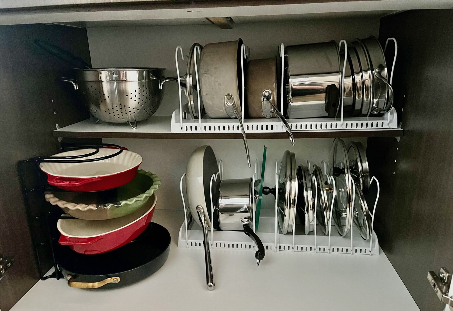 Pots, pans and lids on racks