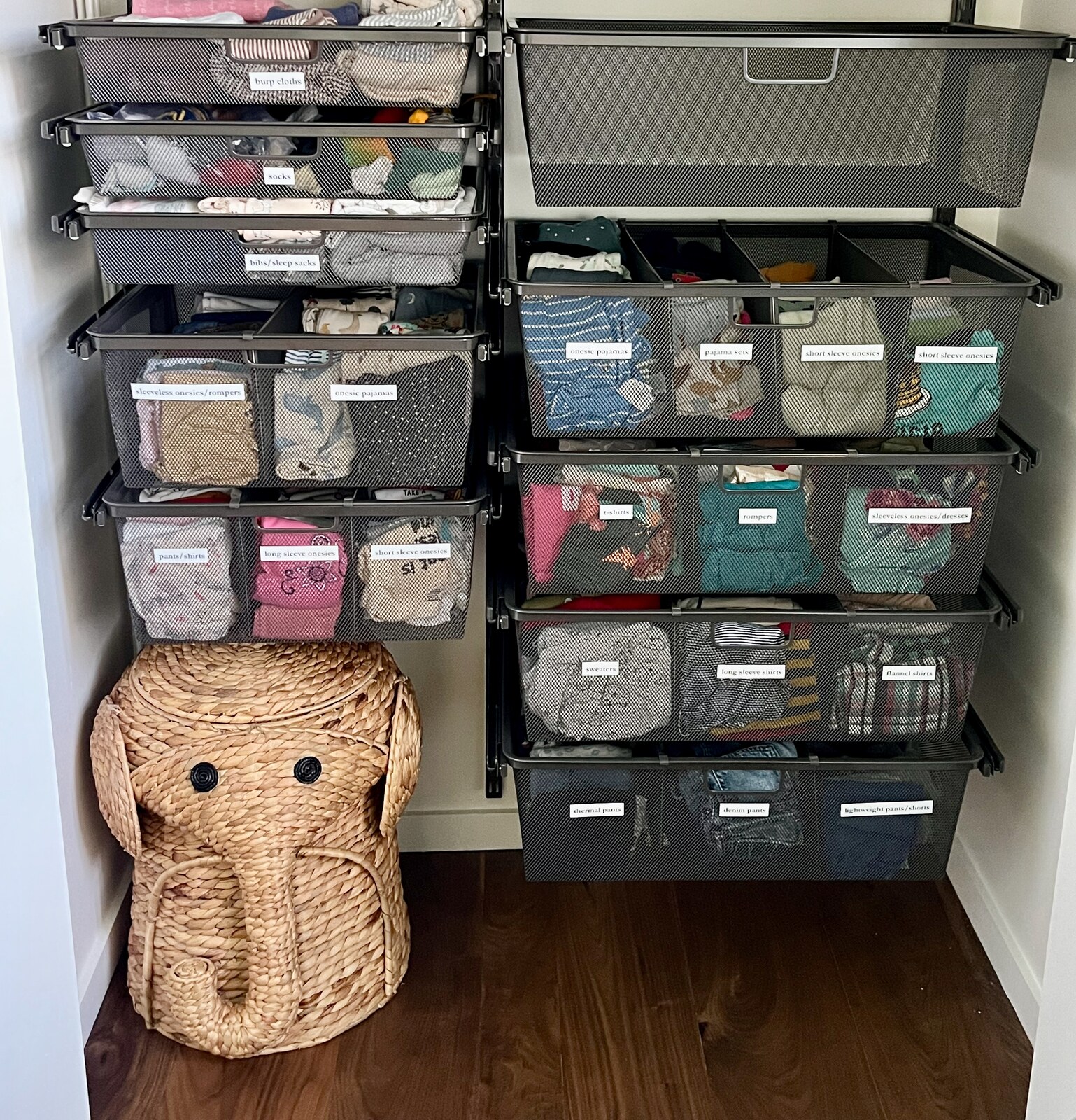 Nursery closet with labeled drawers